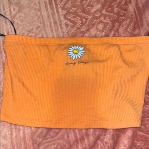 Orange tube top (no straps) shirt that says “sunny days” with a sun.